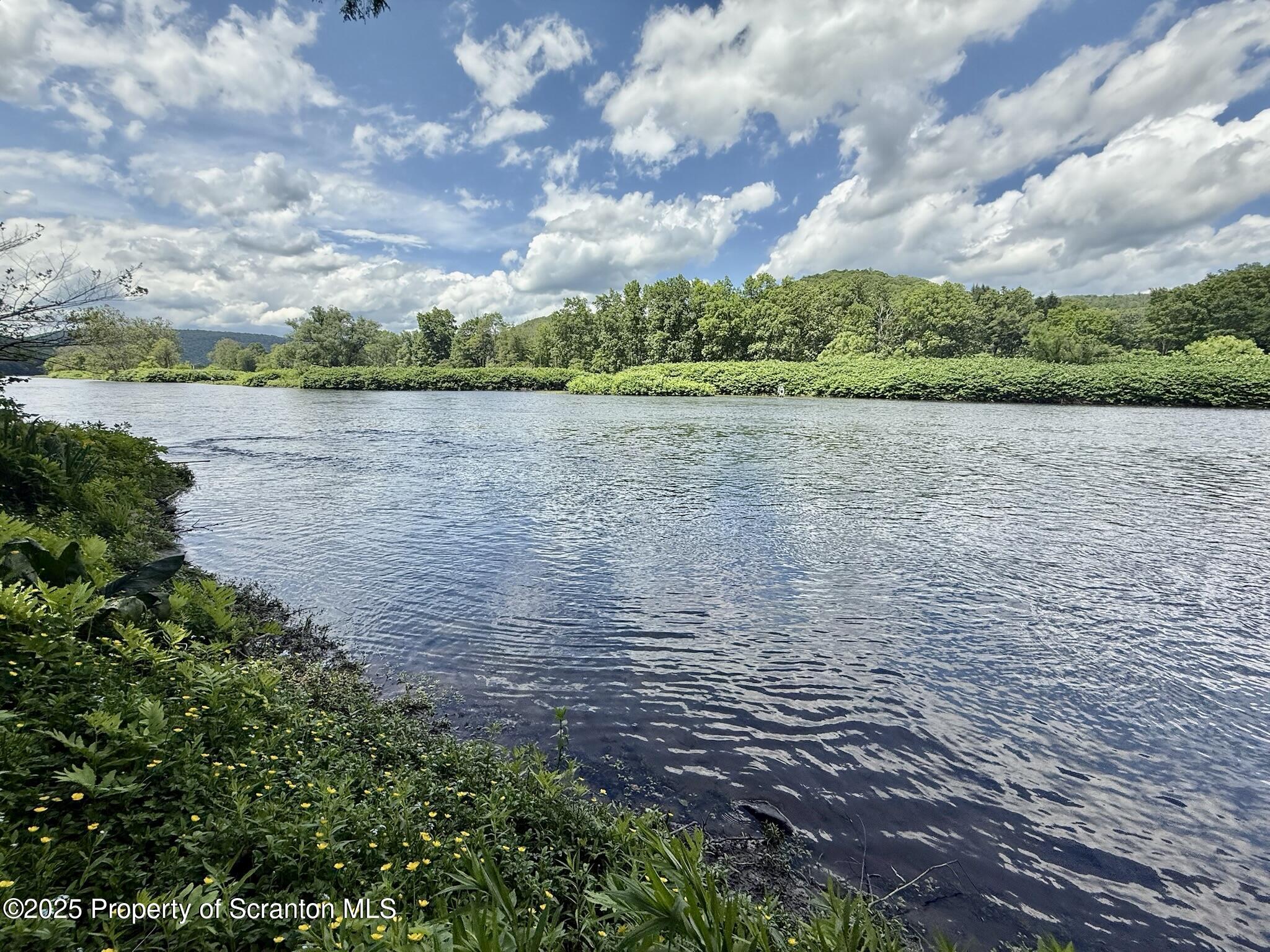 498 Penn-York Road Starlight, PA 18461 - Photo 44 of 48 a view of a lake from a yard