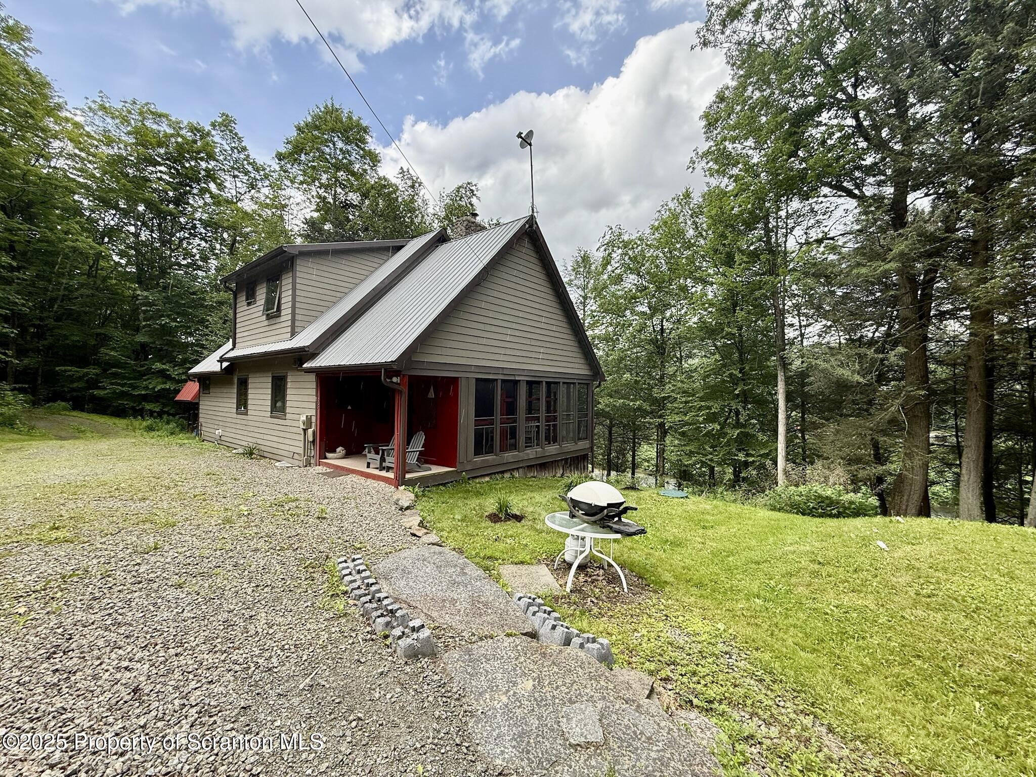 498 Penn-York Road Starlight, PA 18461 - Photo 6 of 48 a house with swimming pool in front of it
