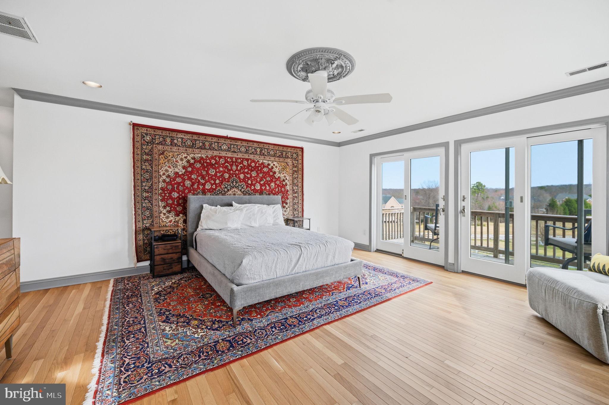 11641 Glen Road Potomac, MD 20854 - Photo 29 of 40 a spacious bedroom with a large bed and a window