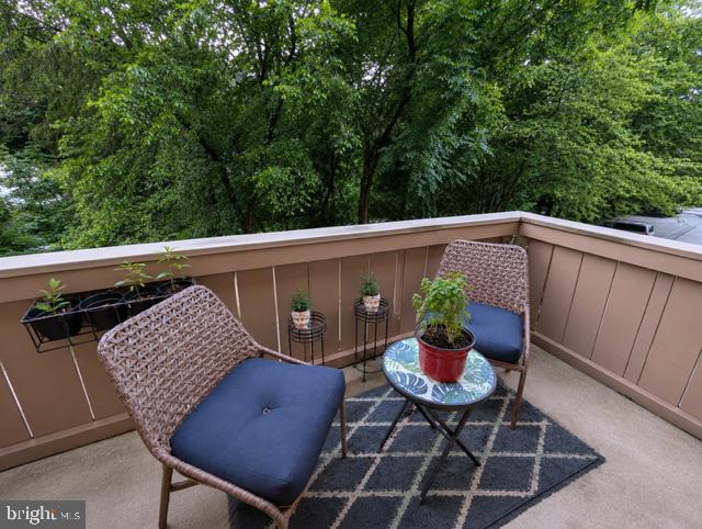 109 Cross Keys Road, Unit R109F Baltimore, MD 21210 - Photo 21 of 28 Serene balcony retreat amidst greenery.