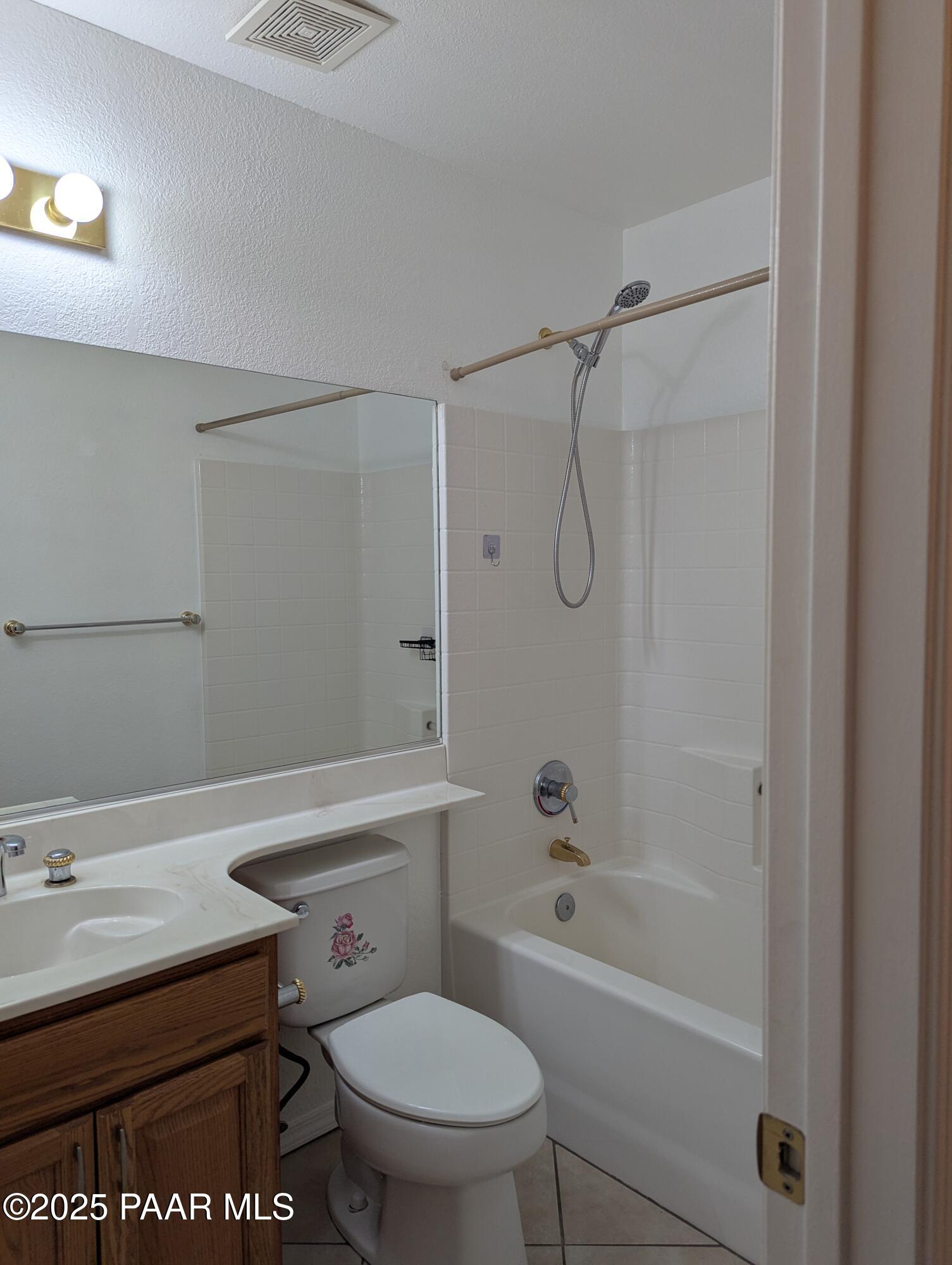 3325 East Yavapai Road, Unit B Prescott Valley, AZ 86314 - Photo 9 of 12 a bathroom with a sink a toilet and a bathtub