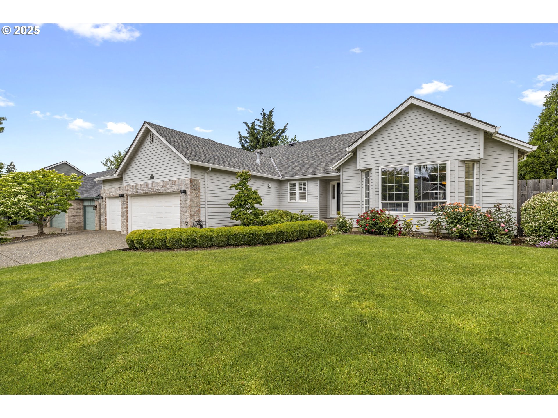 a front view of house with yard and green space