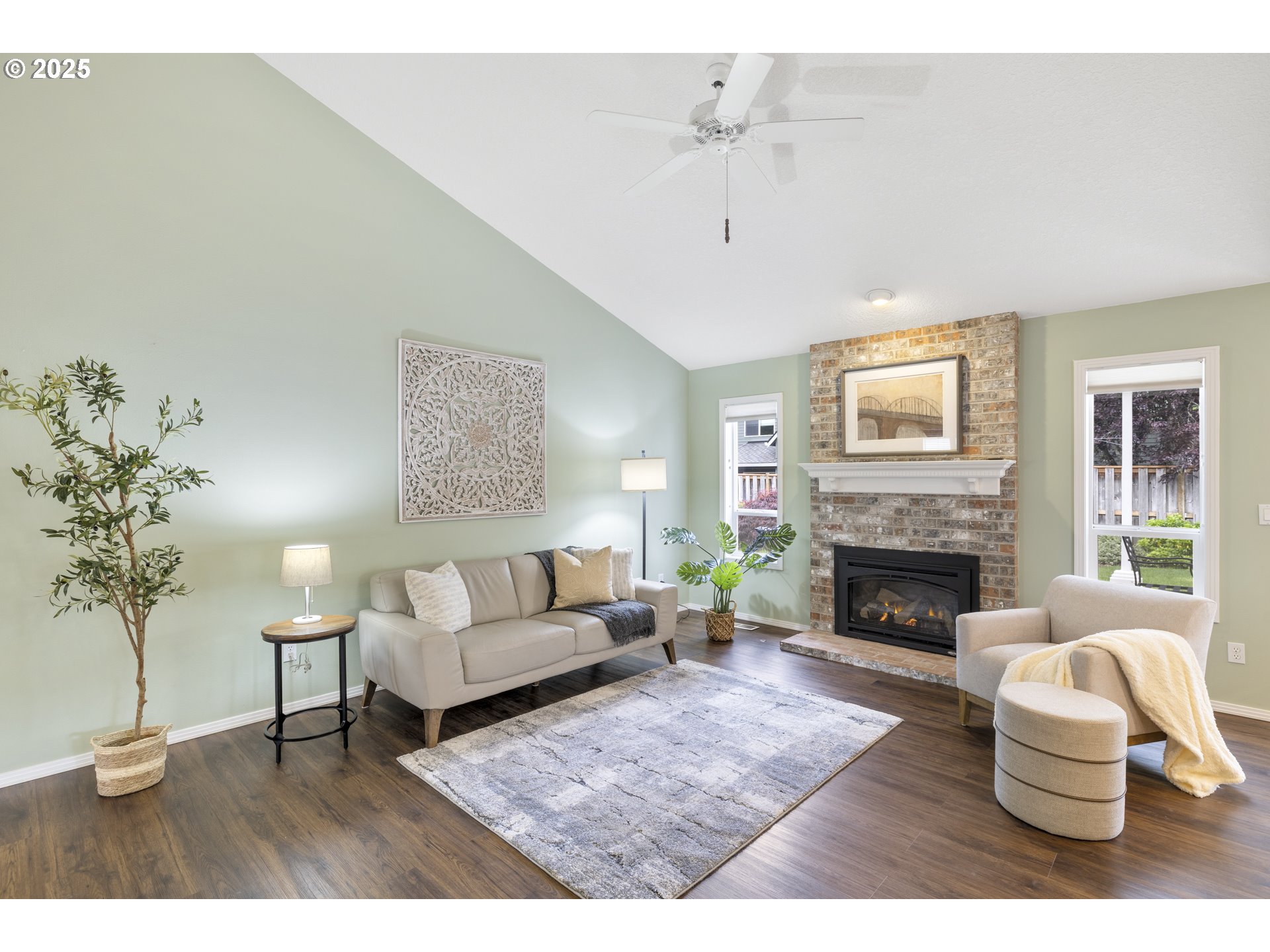 28519 Southwest Cascade Loop Wilsonville, OR 97070 - Photo 13 of 38 a living room with furniture and a fireplace