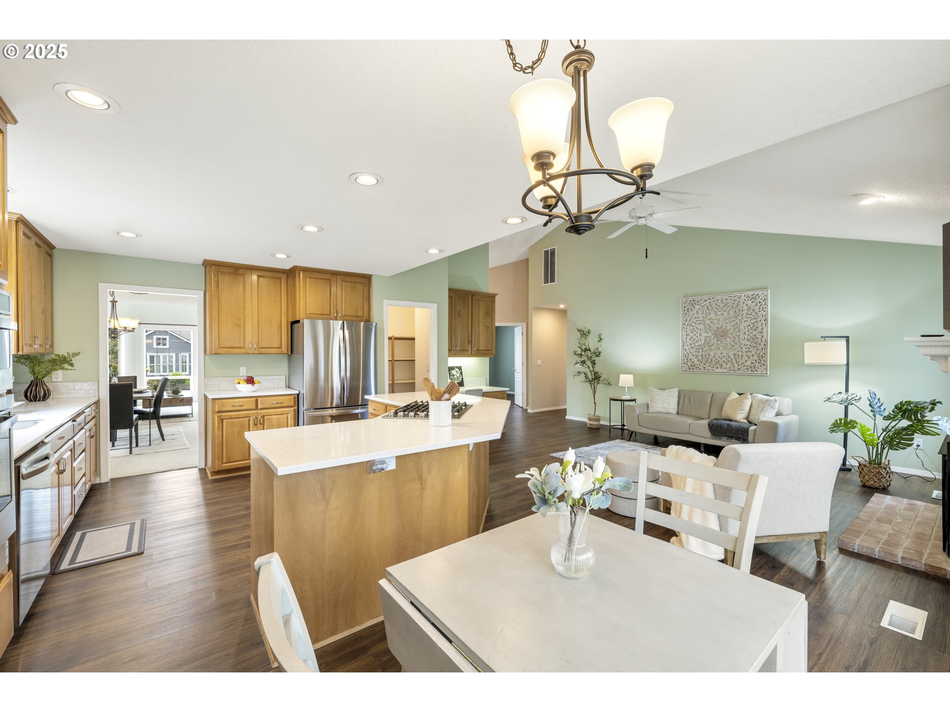 28519 Southwest Cascade Loop Wilsonville, OR 97070 - Photo 19 of 38 a living room with lots of furniture and view of kitchen