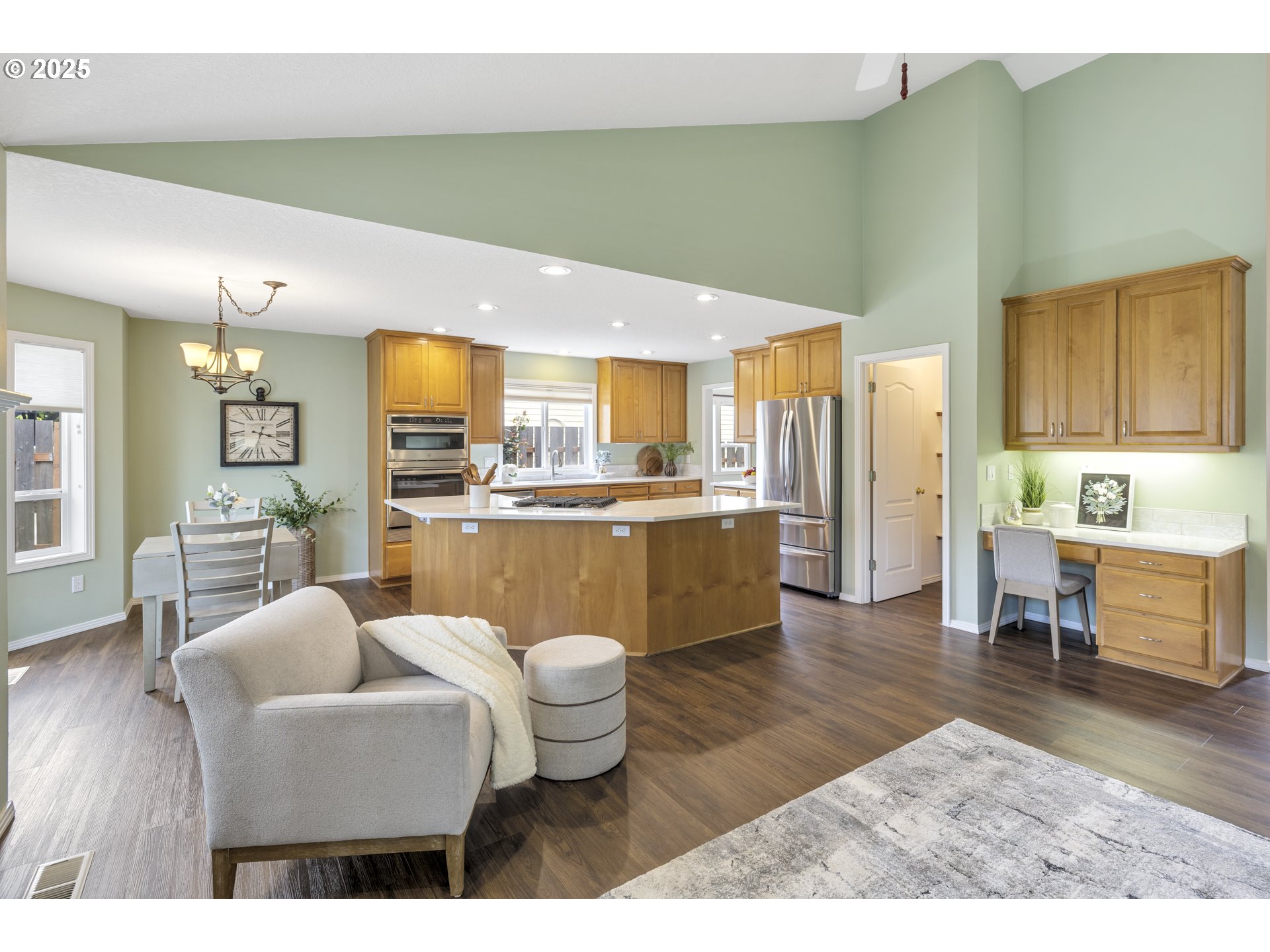 28519 Southwest Cascade Loop Wilsonville, OR 97070 - Photo 20 of 38 a living room with stainless steel appliances kitchen island granite countertop furniture and a kitchen view