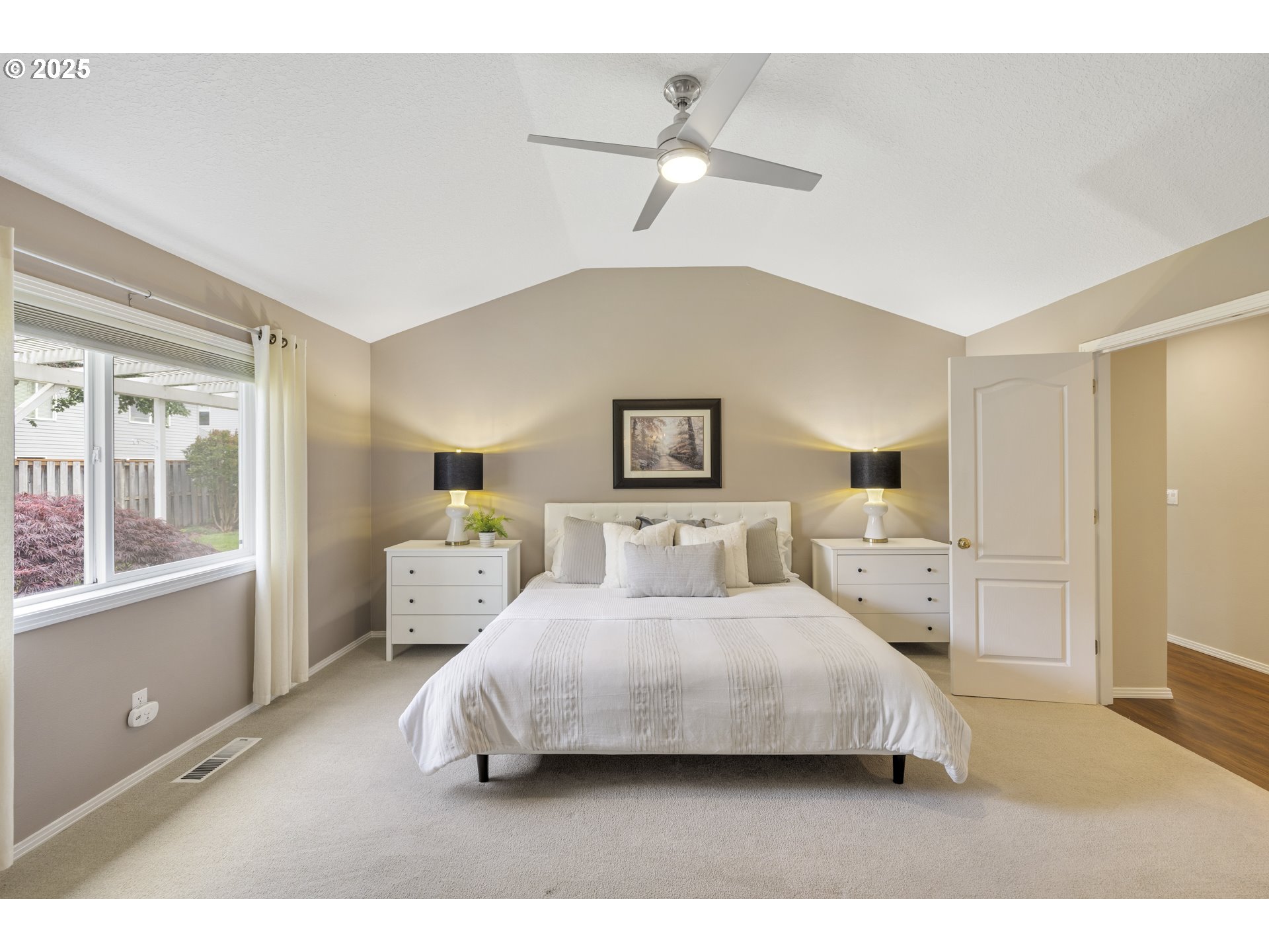28519 Southwest Cascade Loop Wilsonville, OR 97070 - Photo 22 of 38 a bedroom with a bed and window
