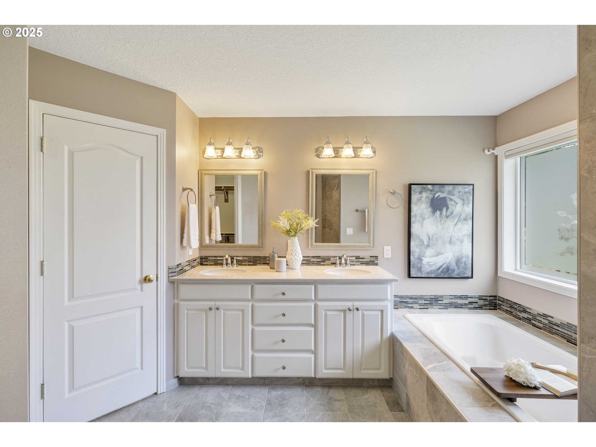 28519 Southwest Cascade Loop Wilsonville, OR 97070 - Photo 23 of 38 a large bathroom with a granite countertop double vanity sink a mirror and a bathtub