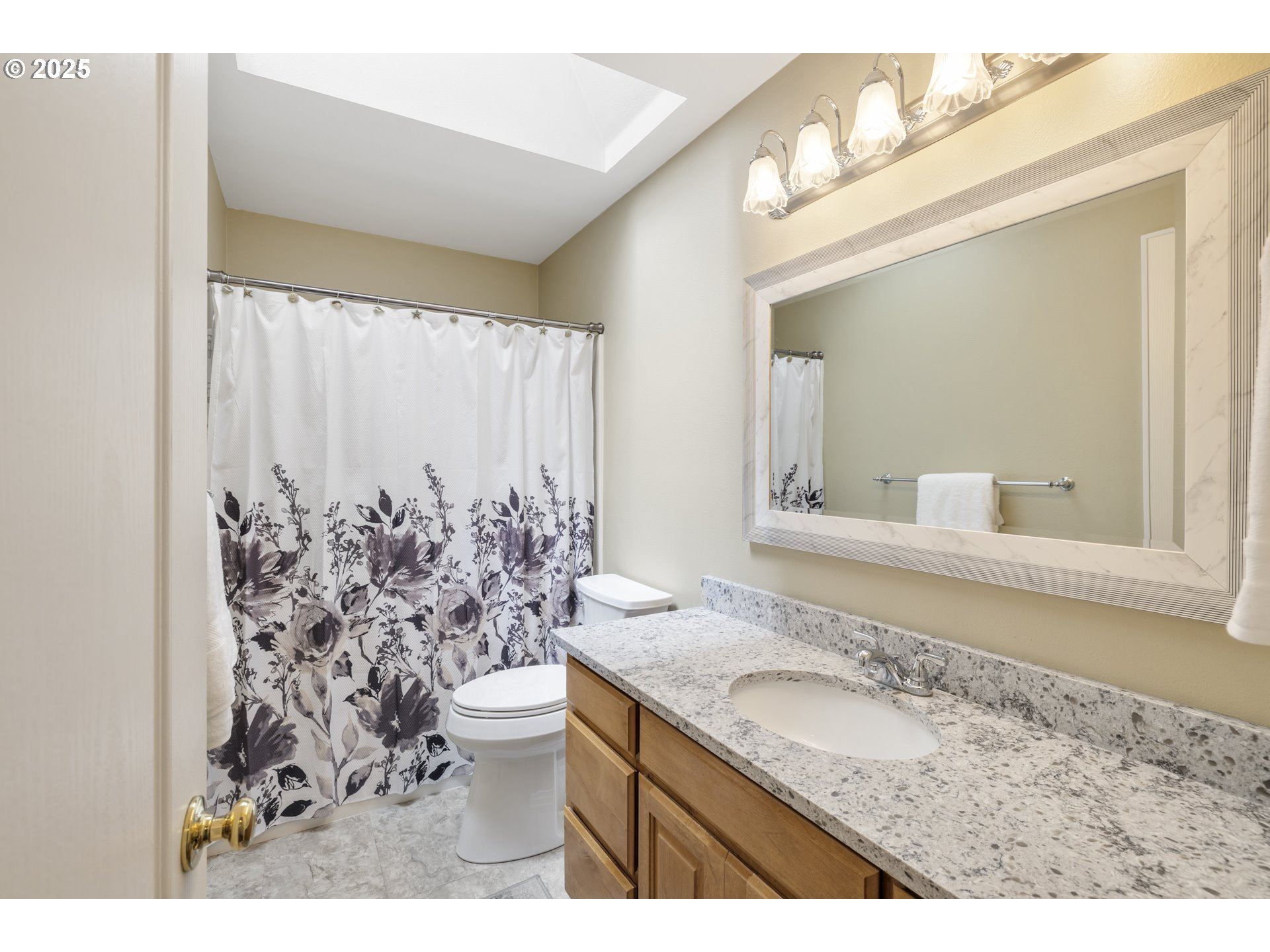 28519 Southwest Cascade Loop Wilsonville, OR 97070 - Photo 27 of 38 a bathroom with a granite countertop sink a toilet and a mirror