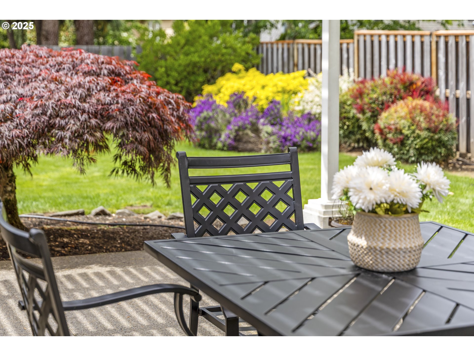28519 Southwest Cascade Loop Wilsonville, OR 97070 - Photo 34 of 38 a view of a chairs and table in backyard