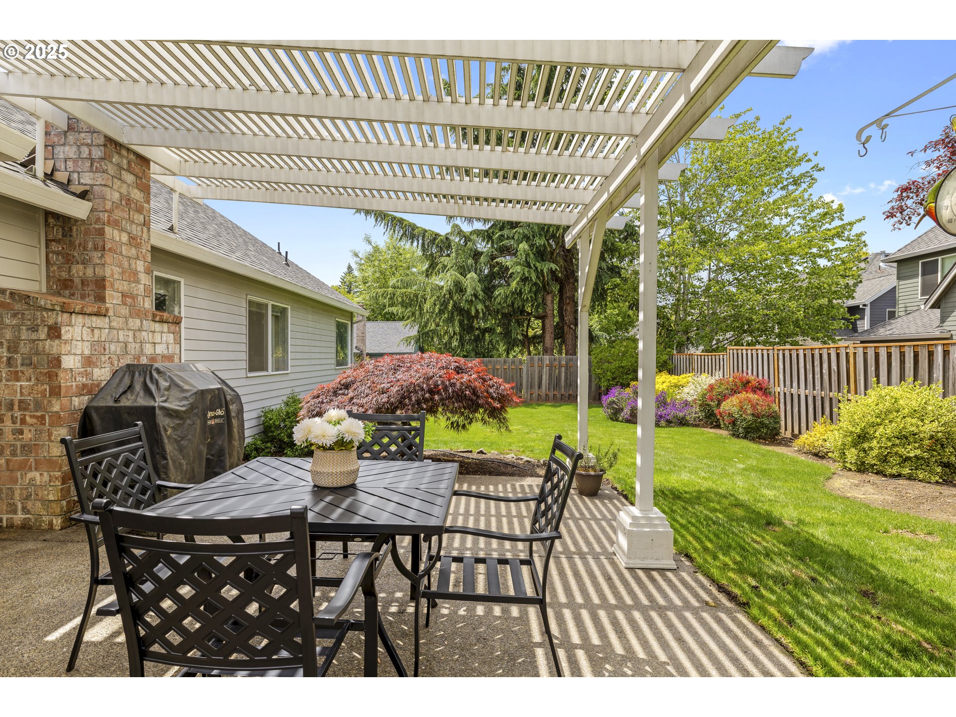 28519 Southwest Cascade Loop Wilsonville, OR 97070 - Photo 35 of 38 a view of a patio with a table and chairs