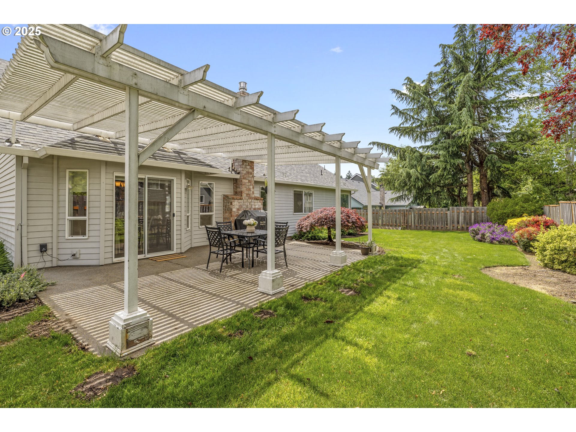 28519 Southwest Cascade Loop Wilsonville, OR 97070 - Photo 36 of 38 a view of a house with backyard porch and sitting area