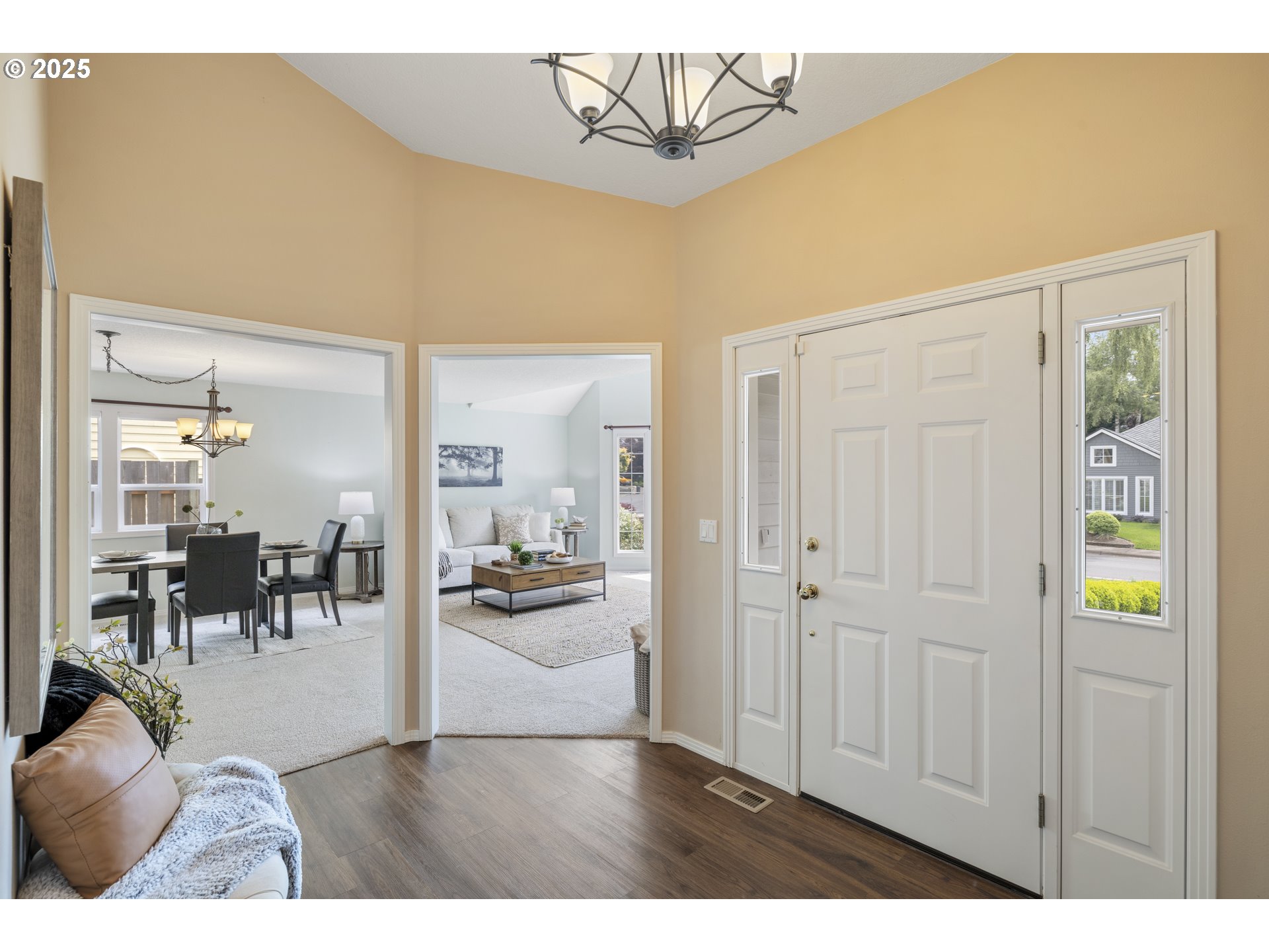 28519 Southwest Cascade Loop Wilsonville, OR 97070 - Photo 5 of 38 a view of living room filled with furniture and chandelier
