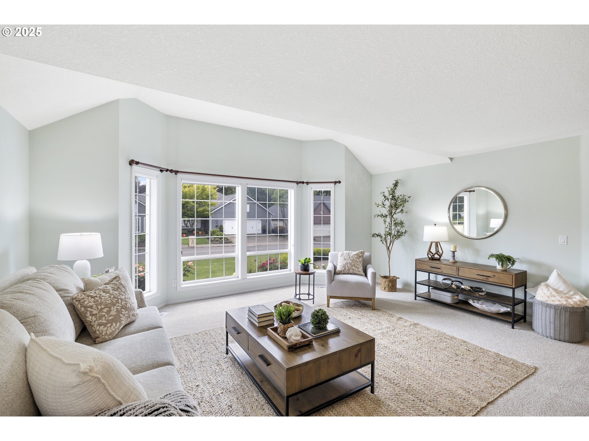 28519 Southwest Cascade Loop Wilsonville, OR 97070 - Photo 9 of 38 a living room with furniture a rug a lamp and a large window