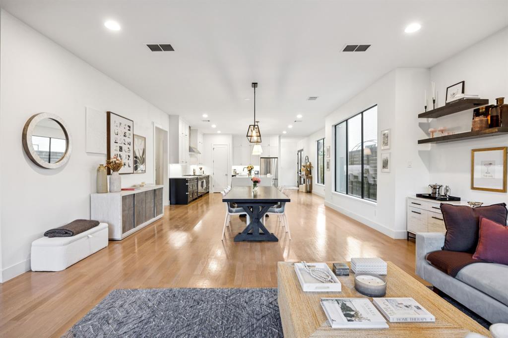 4419 Merrell Road Dallas, TX 75229 - Photo 12 of 27 a living room with fireplace furniture and a wooden floor