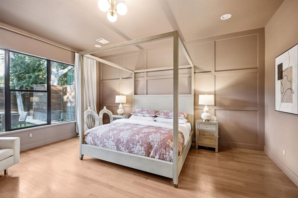 4419 Merrell Road Dallas, TX 75229 - Photo 13 of 27 a bedroom with a bed and a large window