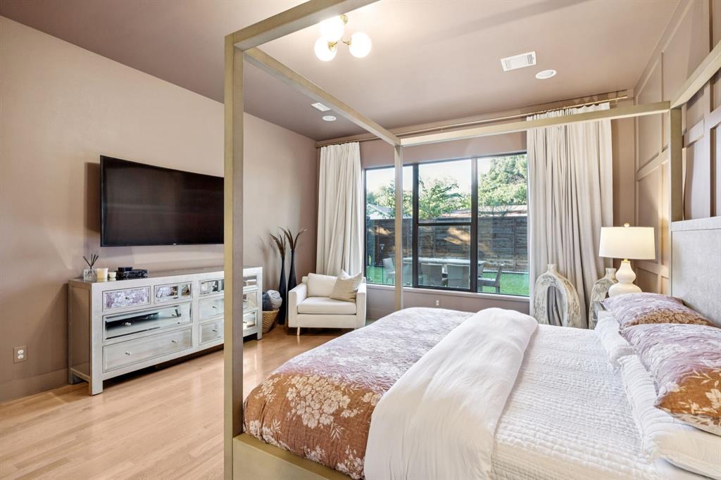 4419 Merrell Road Dallas, TX 75229 - Photo 14 of 27 a bedroom with a bed and a flat screen tv