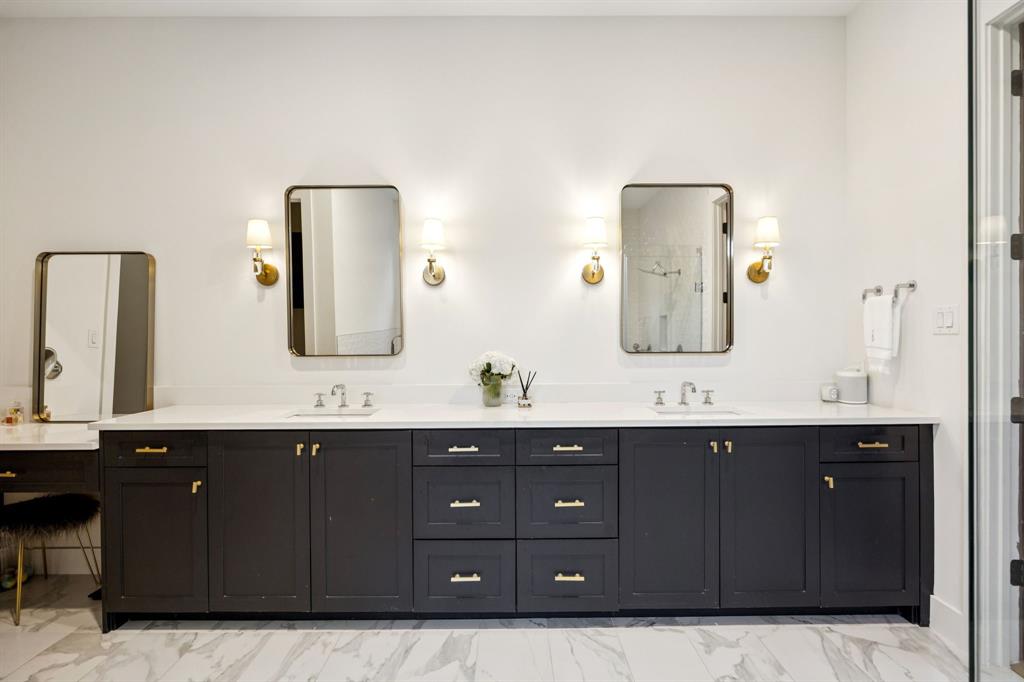 4419 Merrell Road Dallas, TX 75229 - Photo 16 of 27 a bathroom with a double vanity sink and mirror