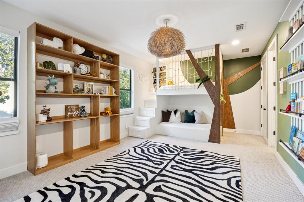 4419 Merrell Road Dallas, TX 75229 - Photo 19 of 27 a bedroom with furniture and a fireplace