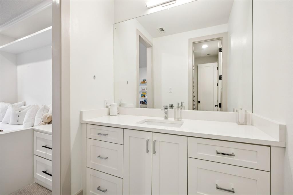 4419 Merrell Road Dallas, TX 75229 - Photo 20 of 27 a bathroom with a sink vanity and mirror