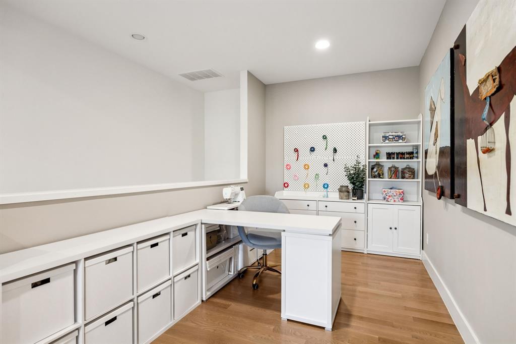 4419 Merrell Road Dallas, TX 75229 - Photo 25 of 27 a kitchen with white cabinets and sink