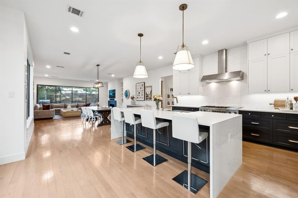 4419 Merrell Road Dallas, TX 75229 - Photo 5 of 27 a kitchen with kitchen island granite countertop lots of counter top space
