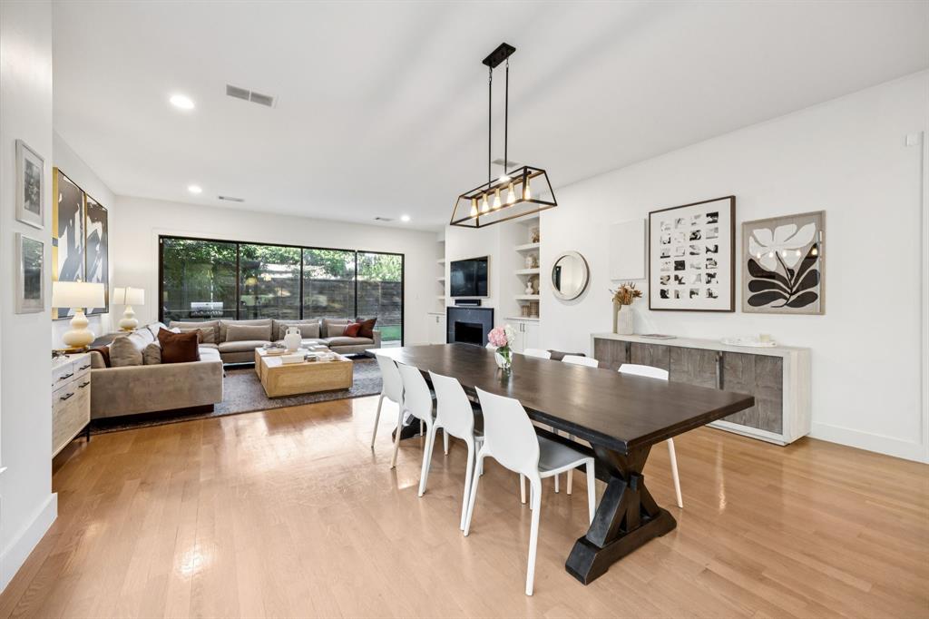 4419 Merrell Road Dallas, TX 75229 - Photo 9 of 27 a view of a dining room with furniture window and wooden floor