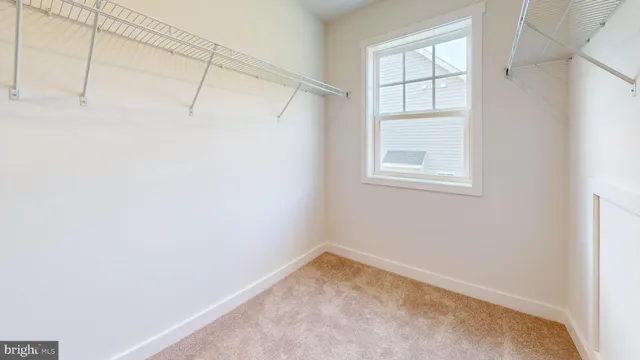 a view of a room with wooden floor and glass door