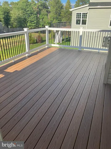 a balcony with wooden floor
