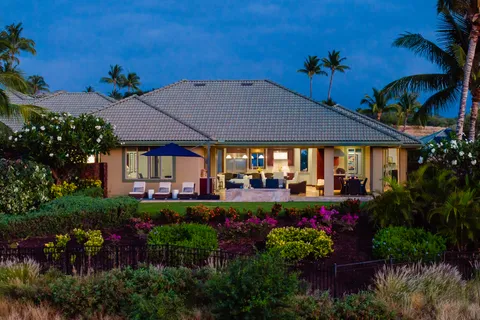 a view of a house with a yard and garden