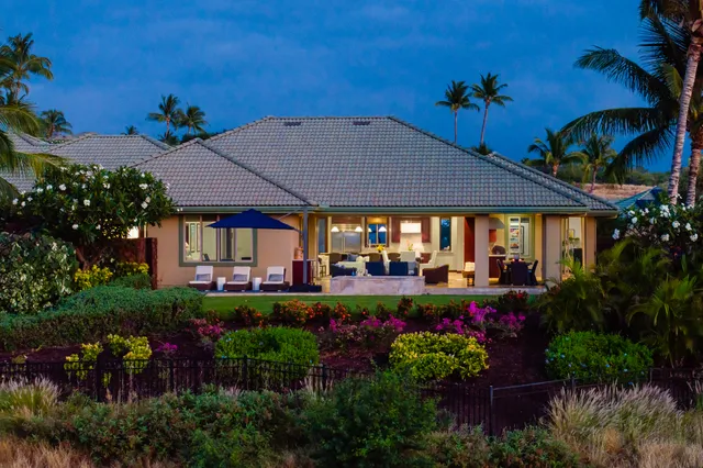 a view of a house with a yard and garden