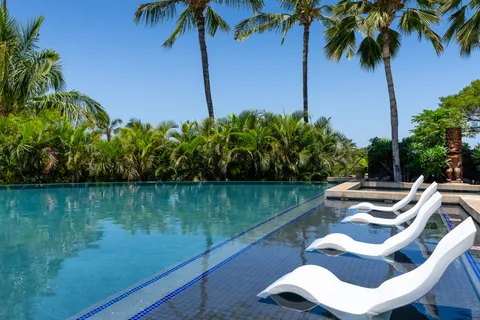 a view of gym equipment with wooden floor