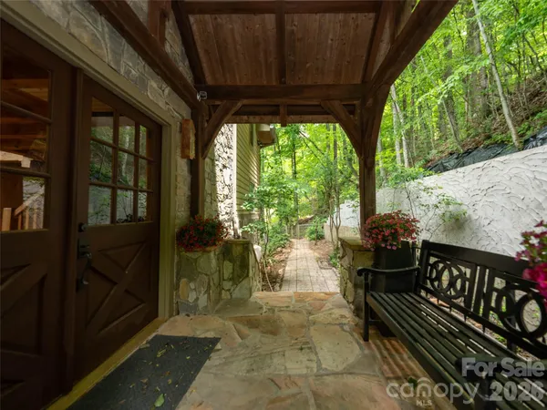 a view of a porch with wooden floor and outdoor space