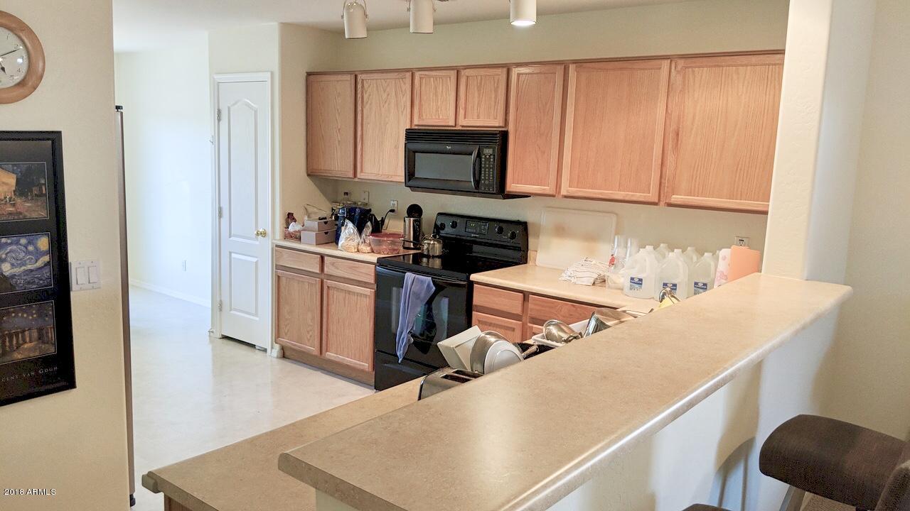 17773 West Calavar Road Surprise, AZ 85388 - Photo 3 of 15 Breakfast Bar Kitchen