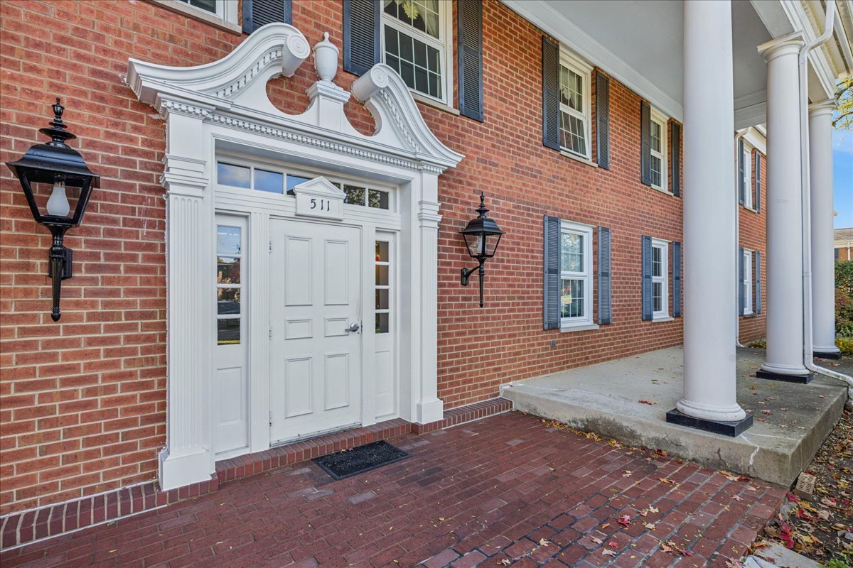 a front view of a house with white walls