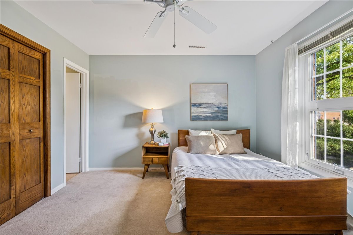 511 Coventry Lane, Unit 2 Crystal Lake, IL 60014 - Photo 13 of 40 a bedroom with a bed and large window