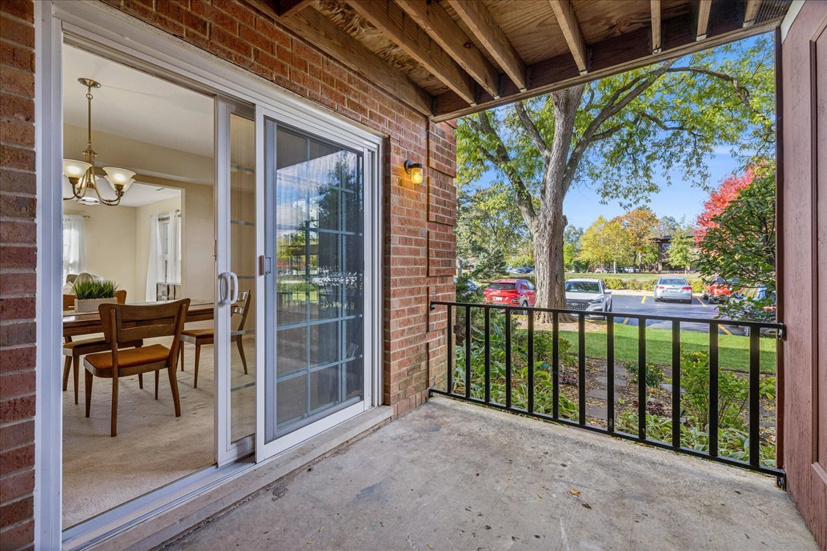 511 Coventry Lane, Unit 2 Crystal Lake, IL 60014 - Photo 18 of 40 a view of a porch with chairs and backyard