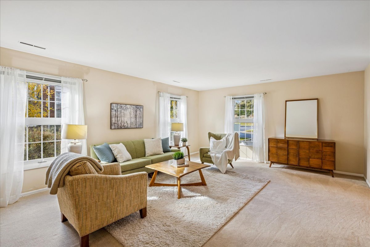 511 Coventry Lane, Unit 2 Crystal Lake, IL 60014 - Photo 6 of 40 a living room with furniture and a window