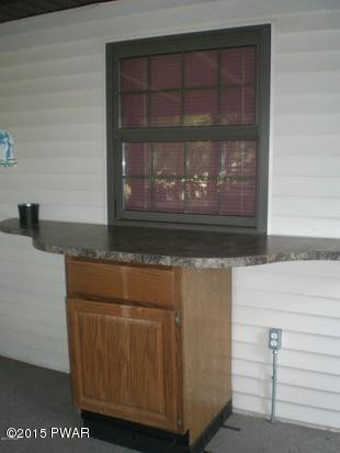 321 Silver Lake Road Dingmans Ferry, PA 18328 - Photo 9 of 42 Window from kitchen to 3-season room
