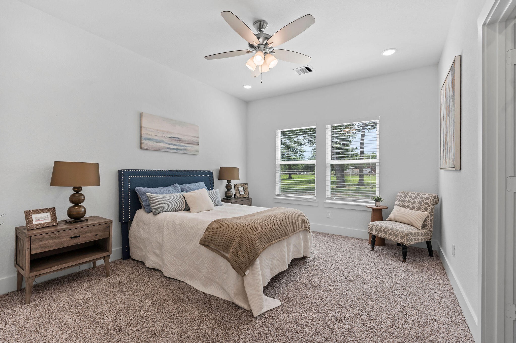 39645 Bosque Road Hempstead, TX 77445 - Photo 18 of 37 a spacious bedroom with a bed and a couch