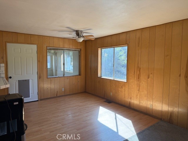 140 Crable Street Frazier Park, CA 93225 - Photo 9 of 16 an empty room with wooden floor and windows