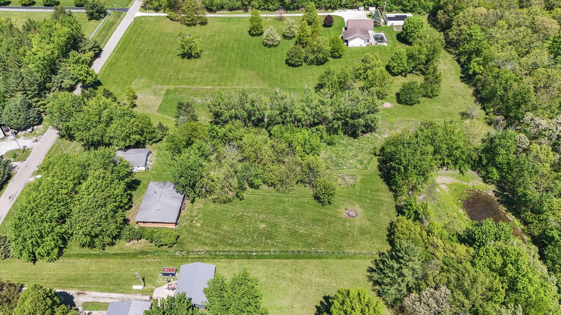 2431 North 1450 East Road Mansfield, IL 61854 - Photo 77 of 78 an aerial view of residential house with outdoor space and trees all around