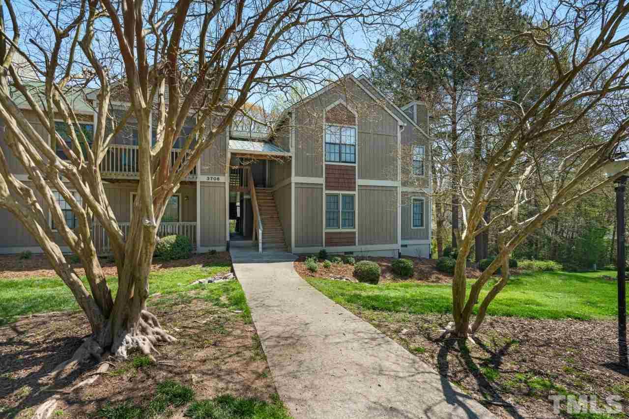 3706 Chimney Ridge Place, Unit 4 Durham, NC 27713 - Photo 1 of 29 a front view of a house with garden