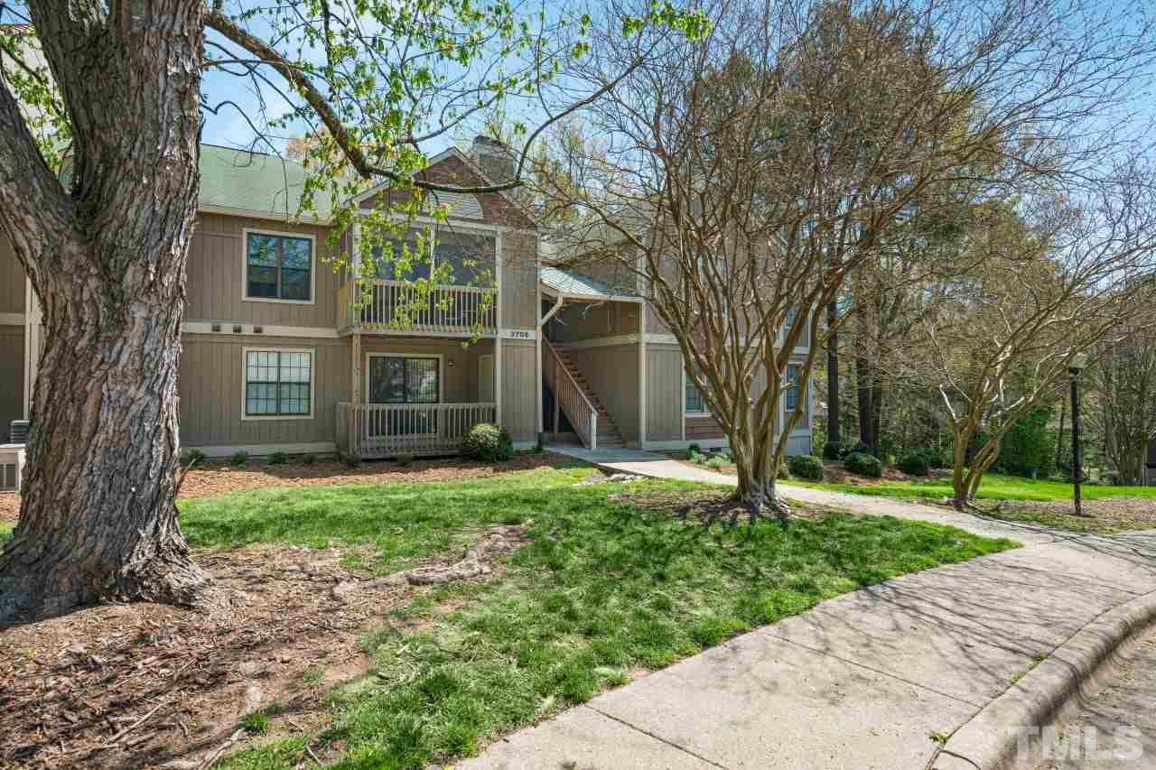 3706 Chimney Ridge Place, Unit 4 Durham, NC 27713 - Photo 2 of 29 a view of a yard in front view of a house