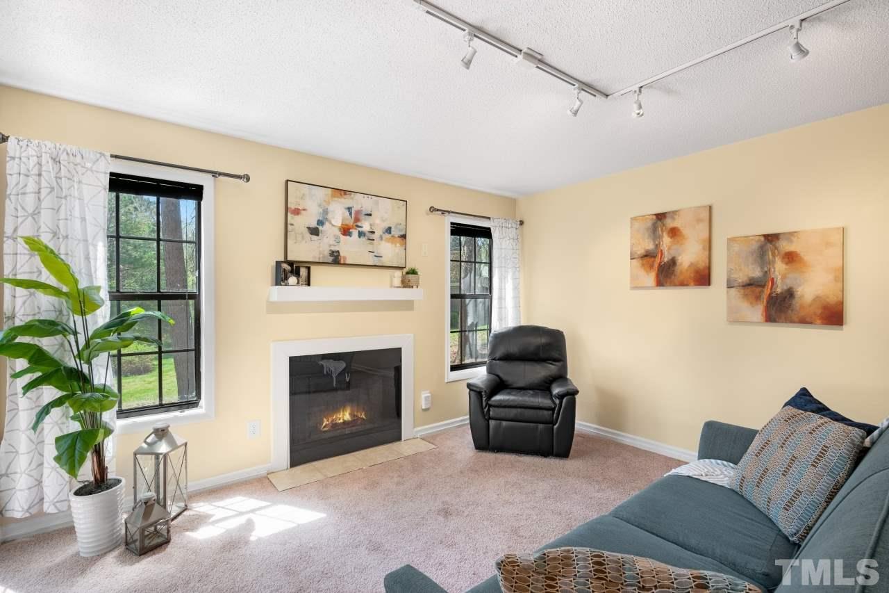 3706 Chimney Ridge Place, Unit 4 Durham, NC 27713 - Photo 14 of 29 a living room with furniture and a fireplace