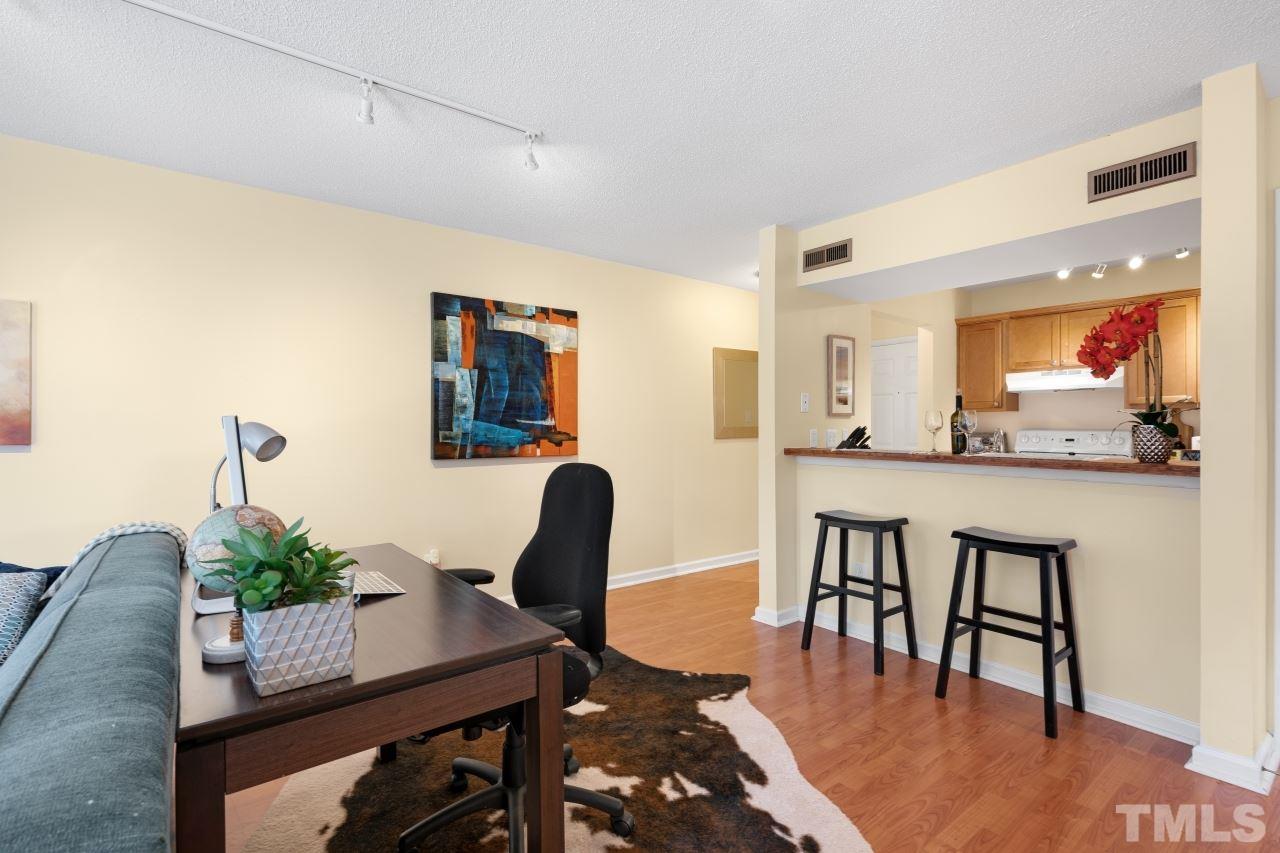 3706 Chimney Ridge Place, Unit 4 Durham, NC 27713 - Photo 15 of 29 a view of a dining room with furniture and wooden floor