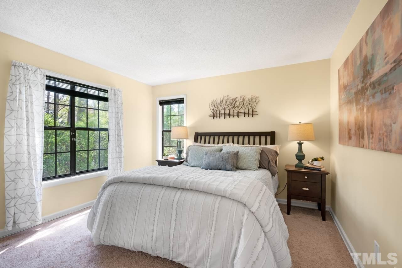 3706 Chimney Ridge Place, Unit 4 Durham, NC 27713 - Photo 16 of 29 a bedroom with a bed and a large window