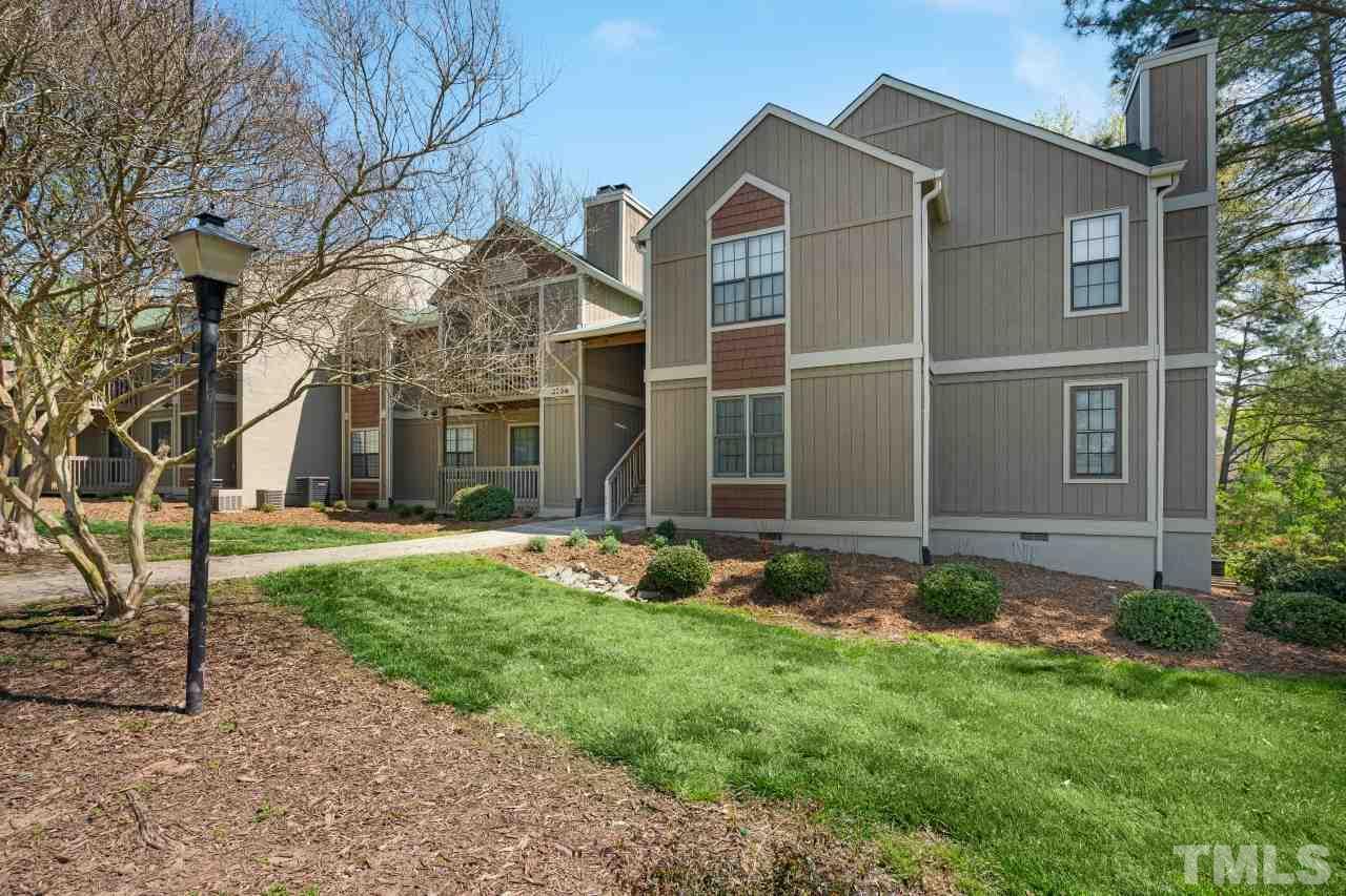 3706 Chimney Ridge Place, Unit 4 Durham, NC 27713 - Photo 3 of 29 front view of a house with a yard