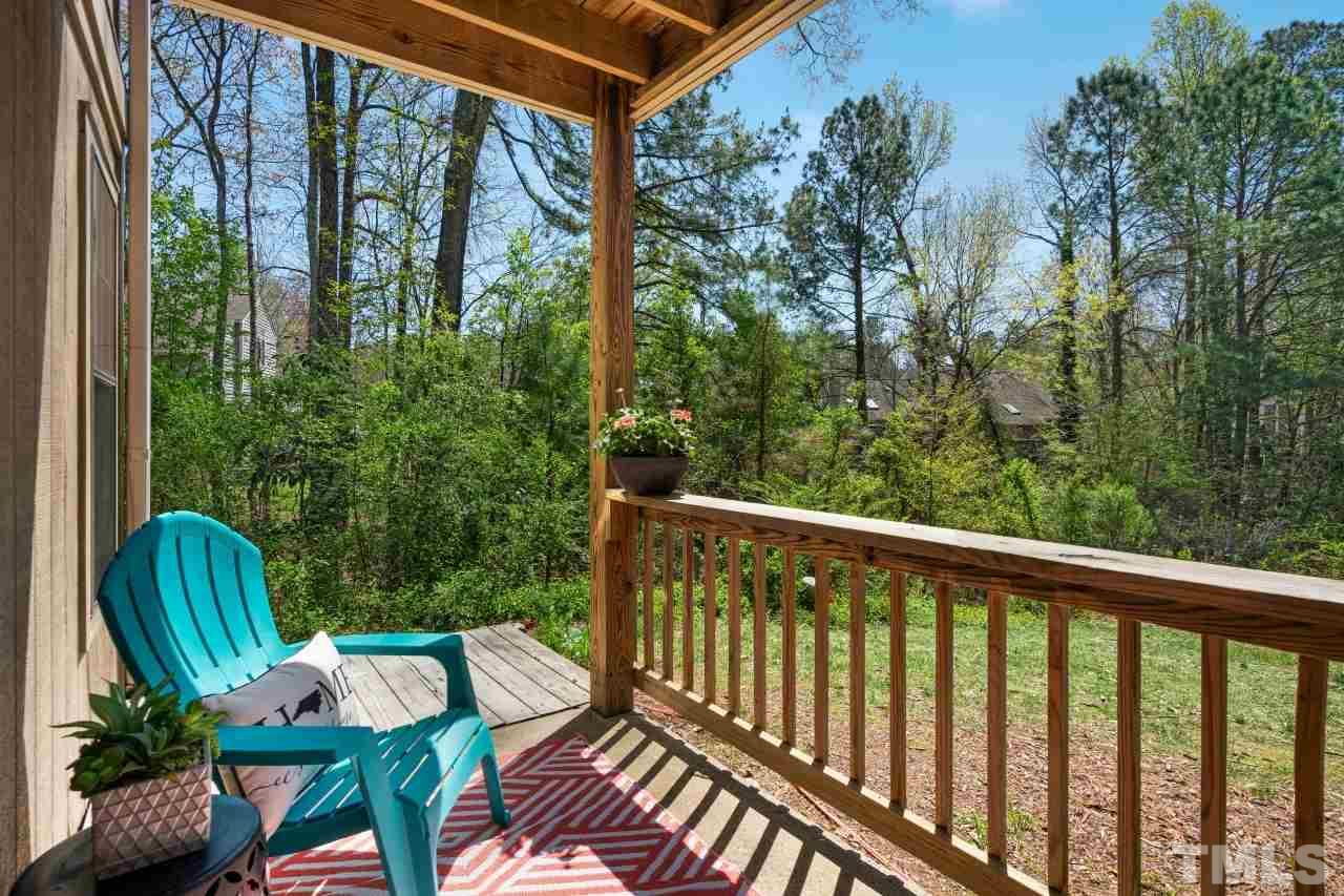 3706 Chimney Ridge Place, Unit 4 Durham, NC 27713 - Photo 23 of 29 a balcony with wooden floor table and chairs