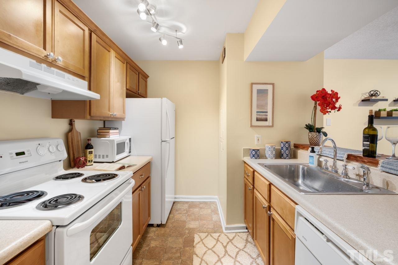 3706 Chimney Ridge Place, Unit 4 Durham, NC 27713 - Photo 4 of 29 a kitchen with a sink stove and refrigerator