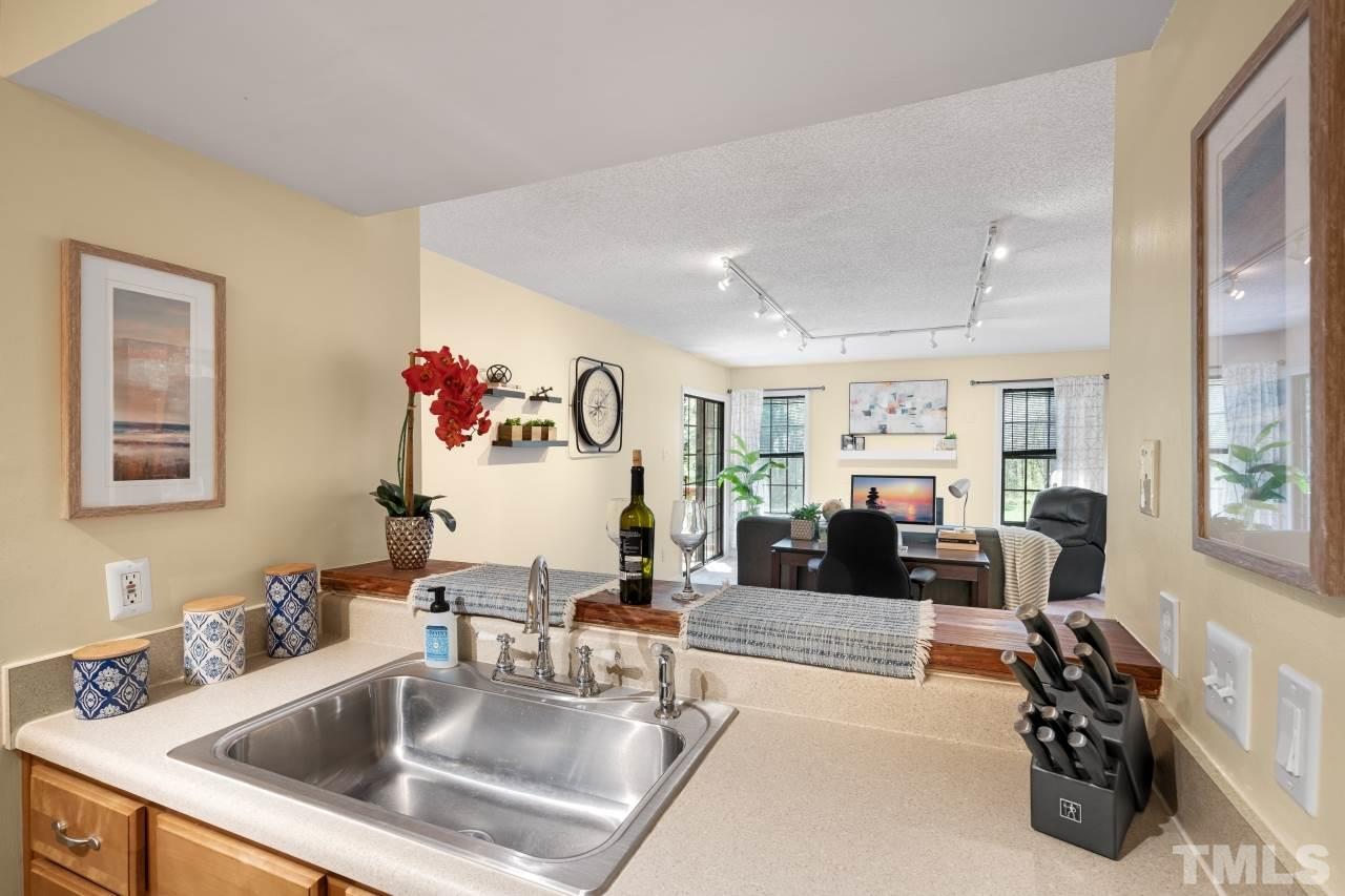 3706 Chimney Ridge Place, Unit 4 Durham, NC 27713 - Photo 6 of 29 a living room with furniture and a flat screen tv